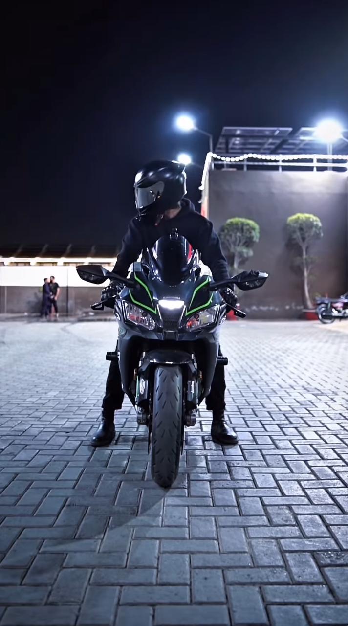 Rider in full gear with cityscape